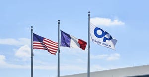 US, French, and Plastic Omnium flags
