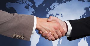 business handshake with global background