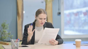 disappointed woman reading document
