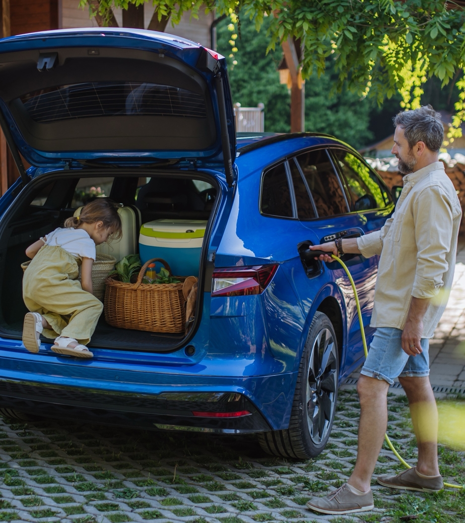 Father charging girl in car