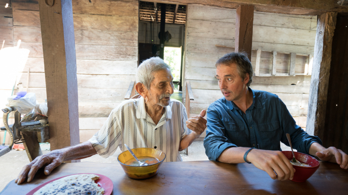 Dan Buettner, right, talks and eats with a man while researching Blue Zones. Credit: David McLain Dan Buettner, right, talks and eats with a man while researching Blue Zones. Credit: David McLain