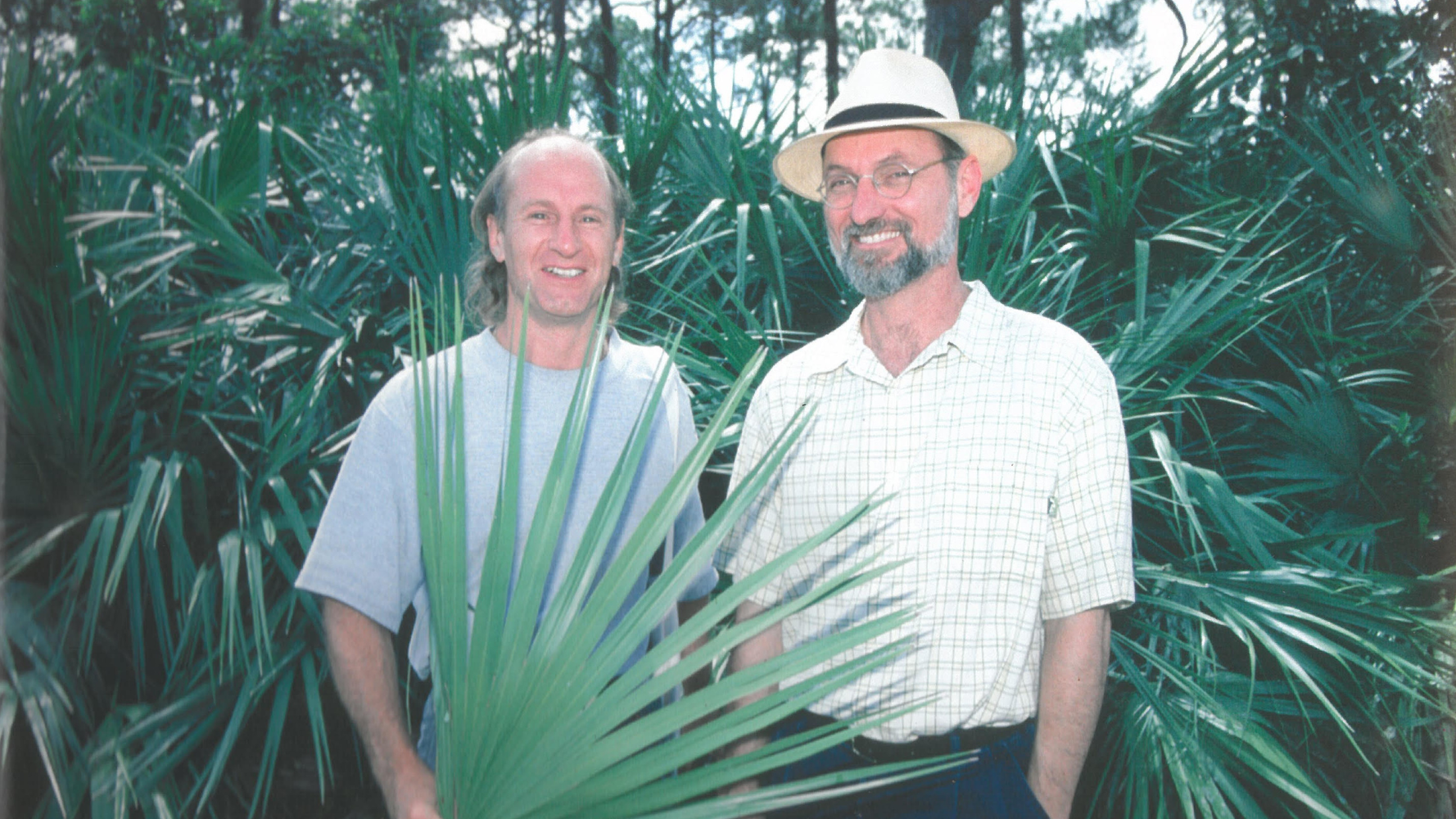 Roy Upton and Michael McGuffin posing with the saw palmetto plant.