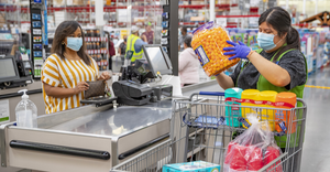 Walmart shopper at checkout during COVID-19