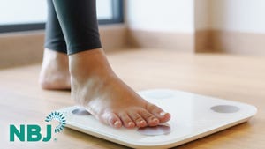 Woman stepping on scale Woman stepping on scale