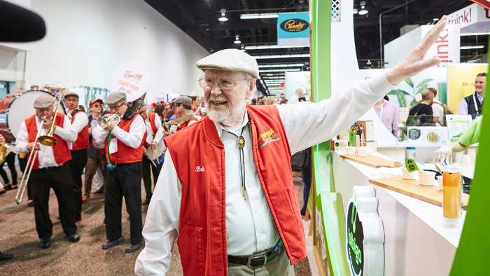 Bob Moore leads his musicians in a parade at Natural Products Expo West in 2019. 