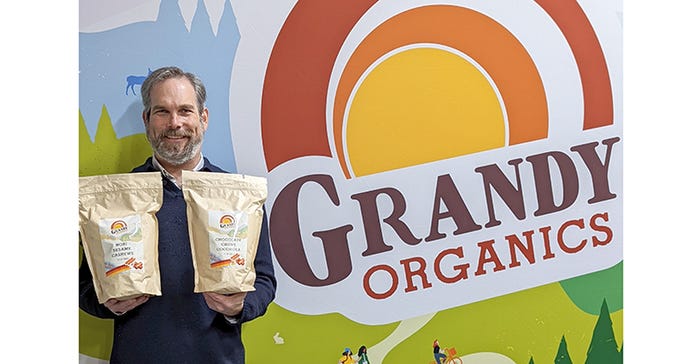 Aaron Anker, owner of Grandy Organics, with new branding