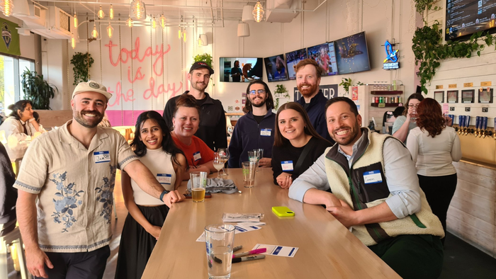 Eight members of Naturally Seattle photos for a photo in the fall of 2024. Eight members of Naturally Seattle photos for a photo in the fall of 2024.