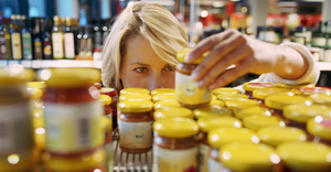 Woman looking at product on shelf