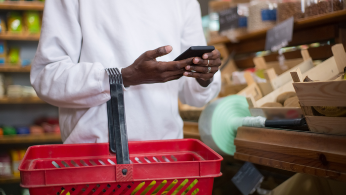 A person shopping at a natural grocery store A person shopping at a natural grocery store