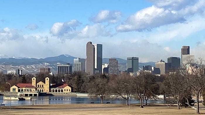 A view of Denver, Colorado, from the east, with the Front Range of the Rocky Mountains just west of the city. Credit: Designbykris, Visit Denver
