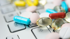 dietary supplements on a laptop computer keyboard