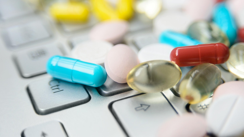 dietary supplements on a laptop computer keyboard dietary supplements on a laptop computer keyboard