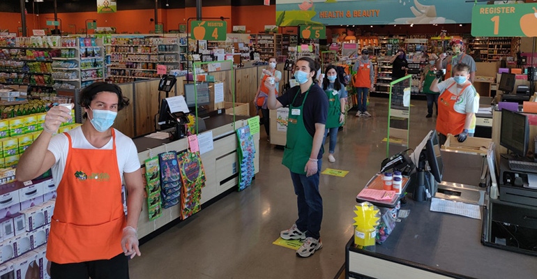Natural Grocers employees demonstrate social distancing during the COVID-19 pandemic.