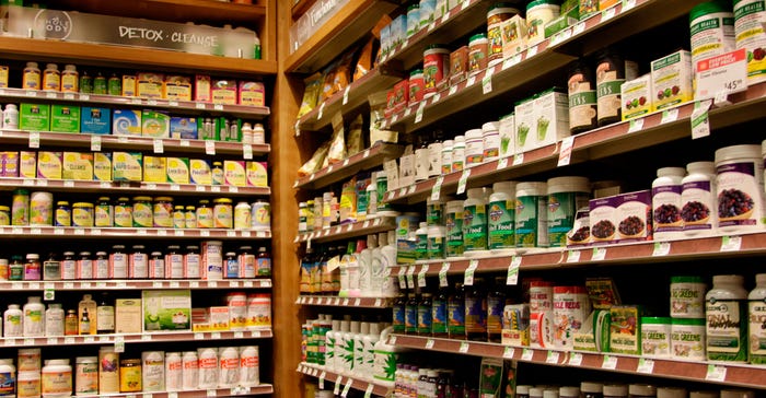 A variety of dietary supplements on shelves in a retail store