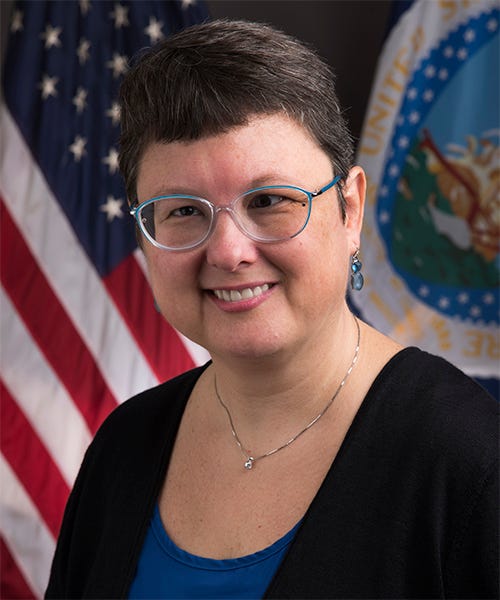 Jennifer Tucker, deputy administrator of the USDA's National Organic Program, poses in front of the U.S. and USDA flags. Jennifer Tucker, deputy administrator of the USDA's National Organic Program, poses in front of the U.S. and USDA flags.