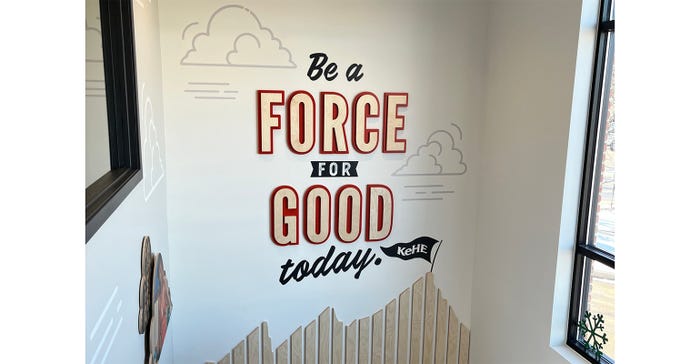 A three-dimensional artistic design in a stairwell reads, "be a force for good today"