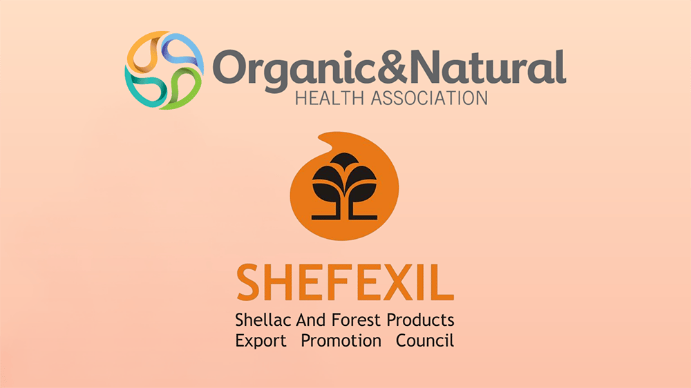 Logos of Organic & Natural Health Association and SHEFEXIL on a peach background Logos of Organic & Natural Health Association and SHEFEXIL on a peach background
