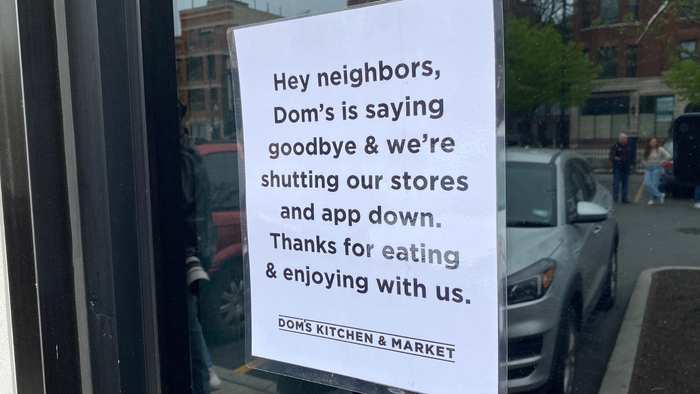 Dom's Kitchen & Market in Lincoln Park attached this notice to the doors after the stores closed around noon on Tuesday, April 23. Credit: CSP Daily News
