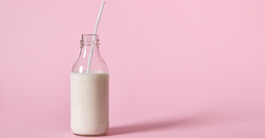 milk bottle pink background