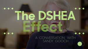 A still image of Sandy Gooch with the text "The DSHEA Effect: A Conversation with Sandy Gooch" overlaid, set in green on a blurred background. A still image of Sandy Gooch with the text "The DSHEA Effect: A Conversation with Sandy Gooch" overlaid, set in green on a blurred background.