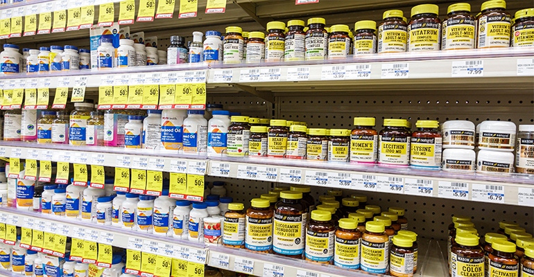 bottles of supplements on the shelves of a mass market retailer bottles of supplements on the shelves of a mass market retailer
