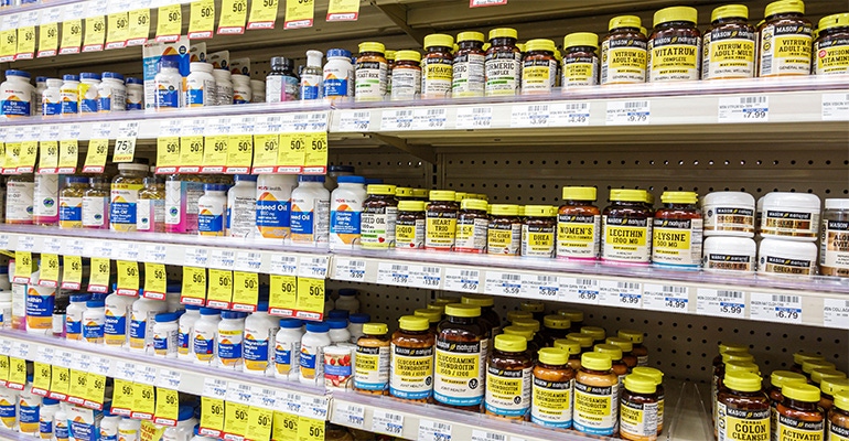 bottles of supplements on the shelves of a mass market retailer