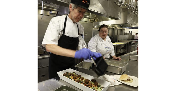 Eric Mercovich, chef de cuisine at Brick City Café and Ritz Sports Zone, and Patricia Falkenstein, junior sous chef at The Commons for Rochester Institute of Technology.