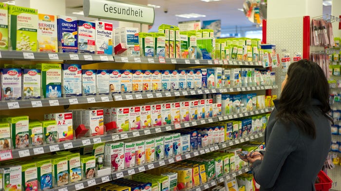A woman shops for dietary supplements at a retail store in Germany. Credit: Alamy A woman shops for dietary supplements at a retail store in Germany. Credit: Alamy