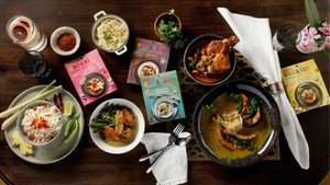 boxed and prepared curries on a table for dinner boxed and prepared curries on a table for dinner