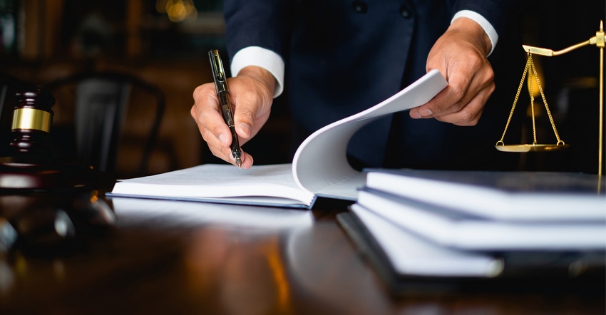 Man signing legal documents