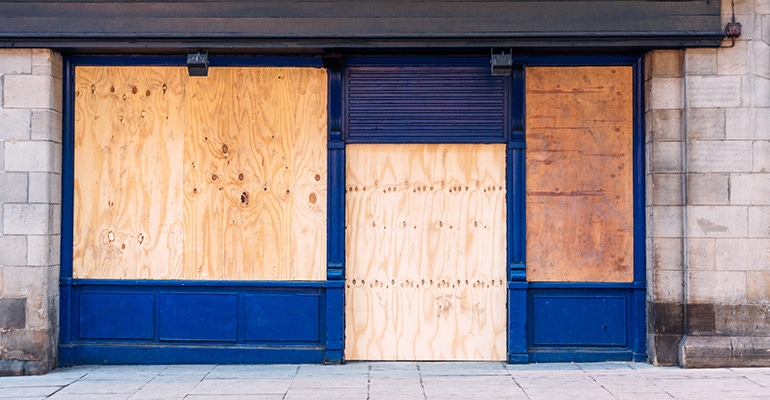 boarded up store windows