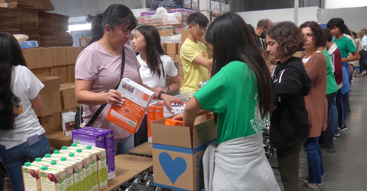 Students packing food boxes