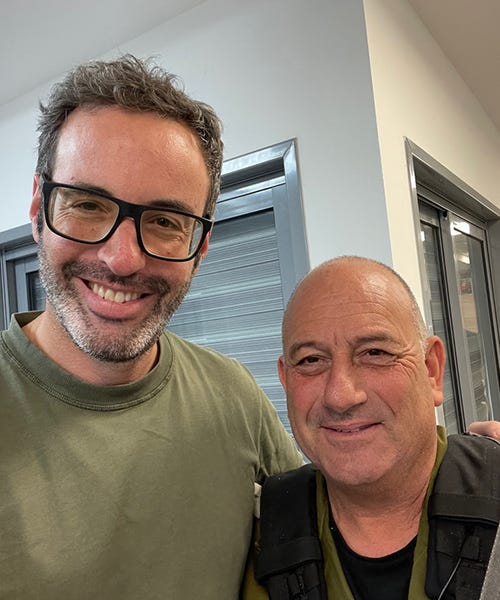 Gil Horsky, co-founder of FLORA Ventures, poses with the head of security in western Negev. Credit: Gill Horsky 