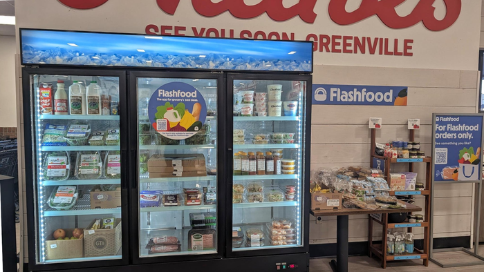A Flashood-branded cooler stores discounted food that is nearing expiration. A Flashood-branded cooler stores discounted food that is nearing expiration.