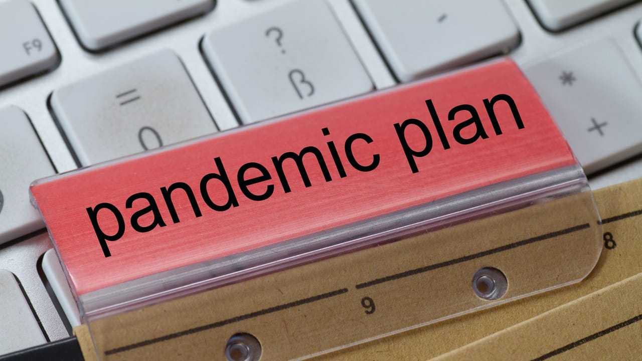 The words "pandemic plan" on top of a keyboard