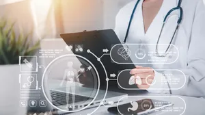 Doctor in uniform with stethoscope writing something information of patient prescription medical in paperwork checklist on clipboard on front laptop. Doctor in uniform with stethoscope writing something information of patient prescription medical in paperwork checklist on clipboard on front laptop.