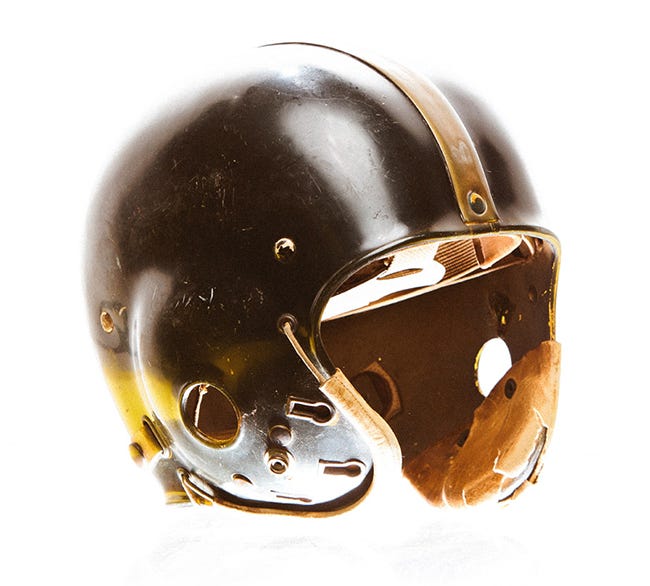 first plastic football helmet