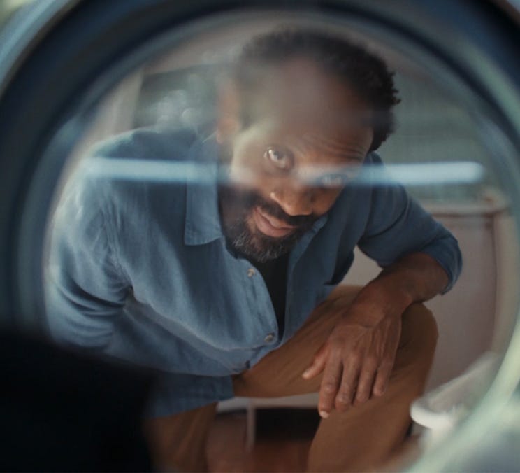 Man loading his washing machine