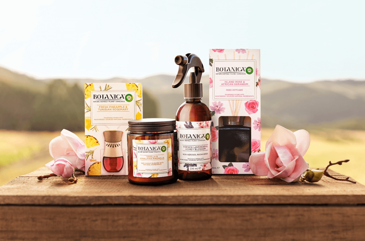 Landscape shot of flower meadow with Botanica products in the centre