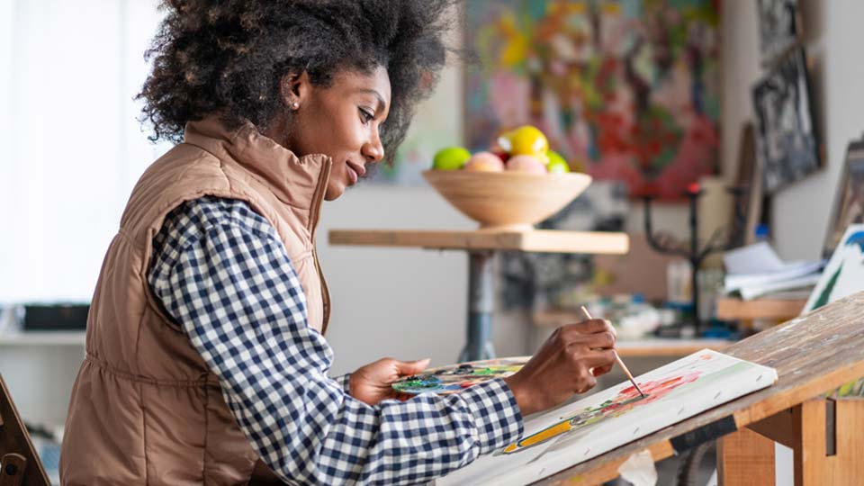 Painter painting on canvas