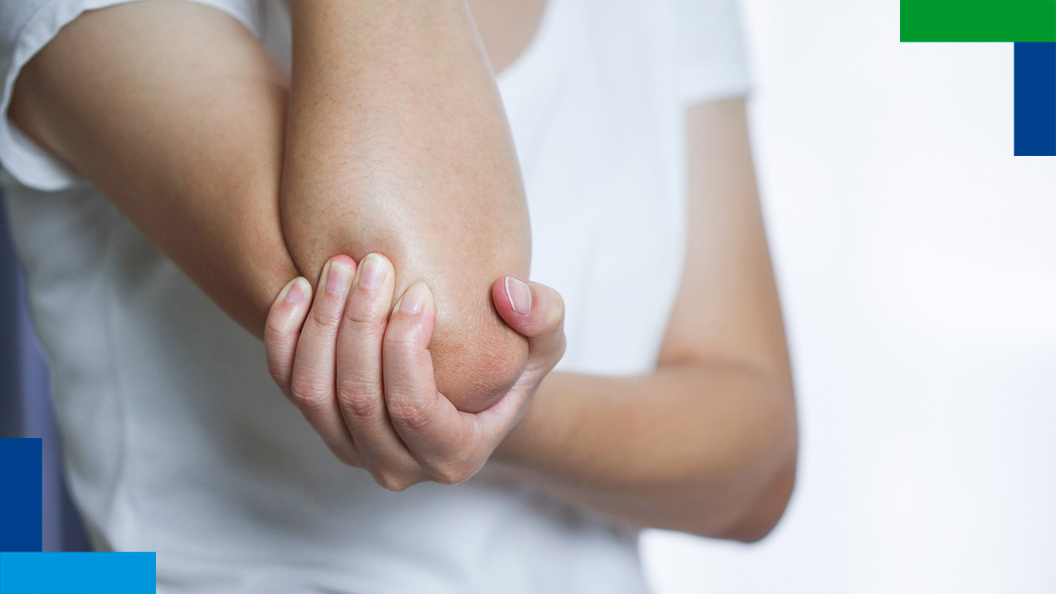 Person holding elbow