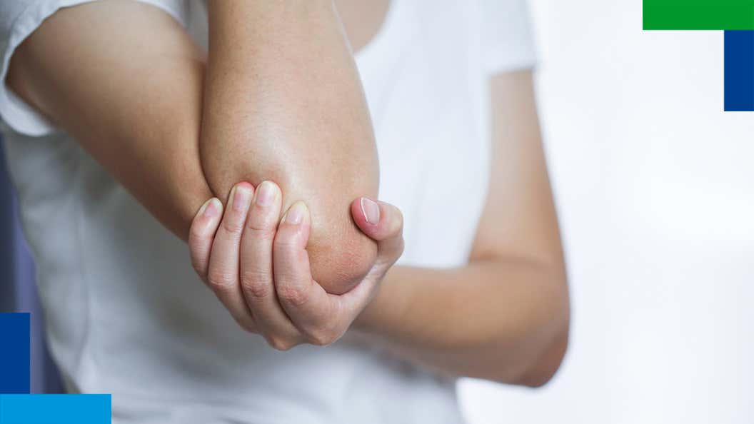 Person holding elbow