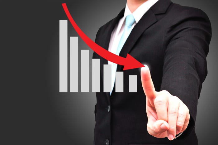 Man pointing to graph showing revenue decline
