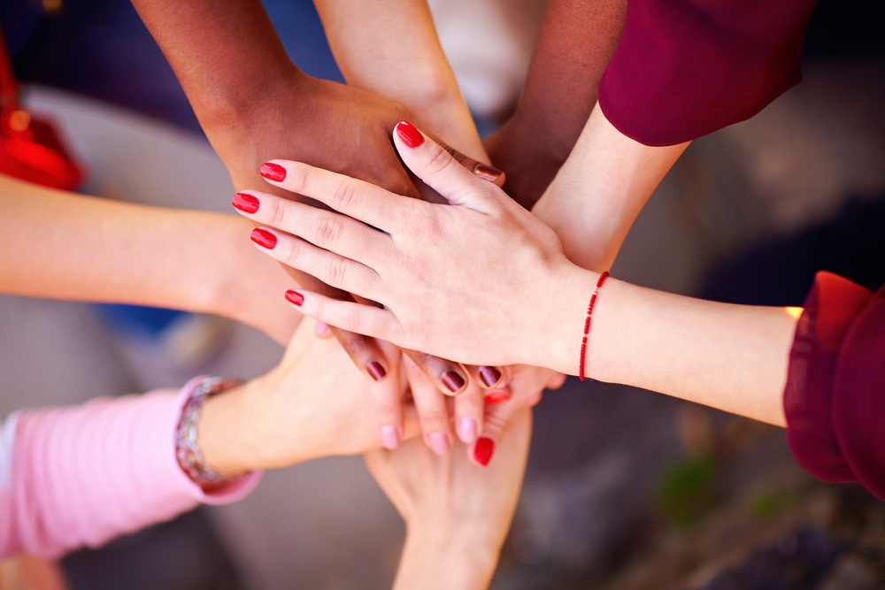 Women's hands joined together