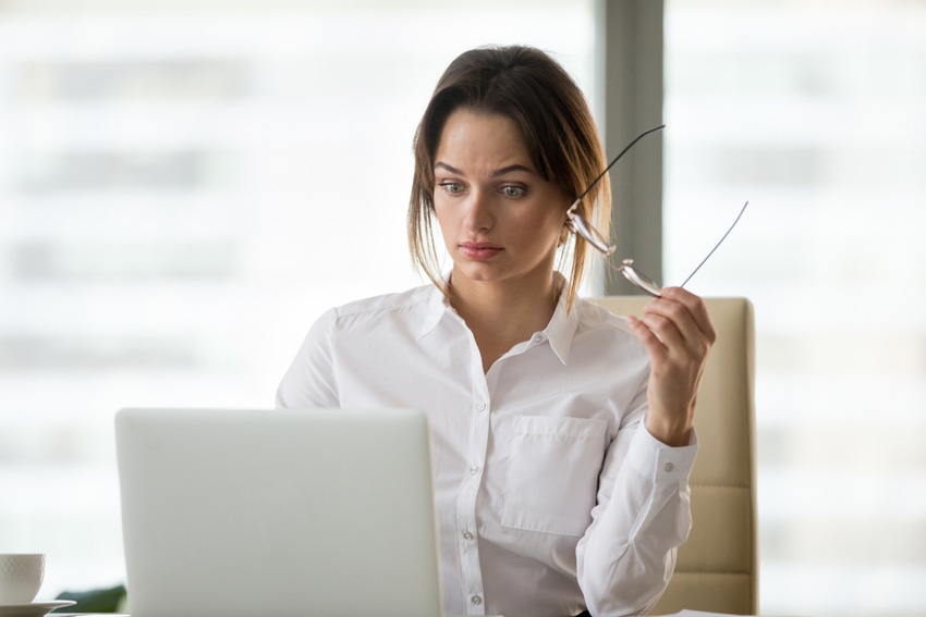 Businesswoman surprised at laptop Businesswoman surprised at laptop