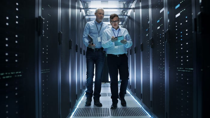 Two people in a data center