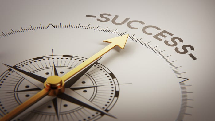 Compass pointing to word success