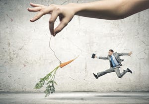 Businessman chasing after a dangling carrot incentive