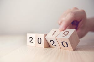Hand change wooden cubes with New year 2019 to 2020 concept.