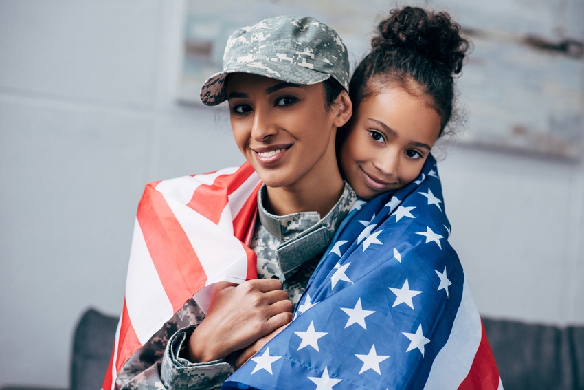 Woman of color soldier with daughter